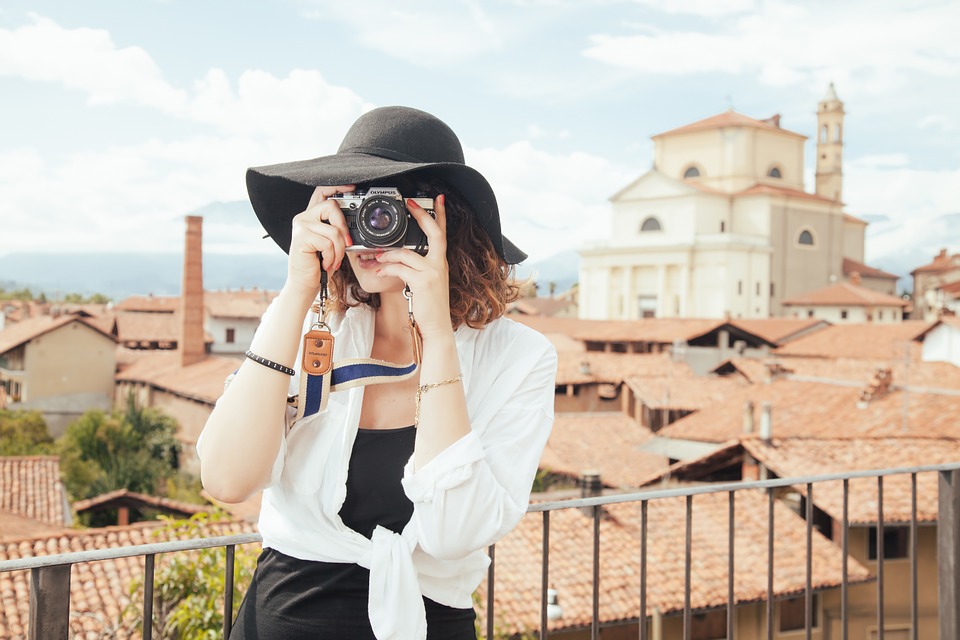 Tourist holding camera