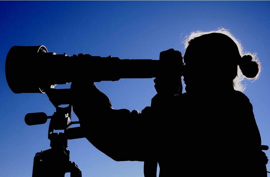 Man looking at Telescope